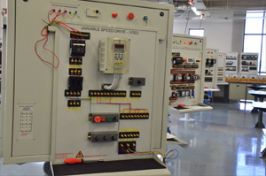 In the Electrical Machines Lab students apply their fundamental knowledge acquired from theory and build circuits on the test panels. The circuit being built is a variable speed drive as it would be used in industry.